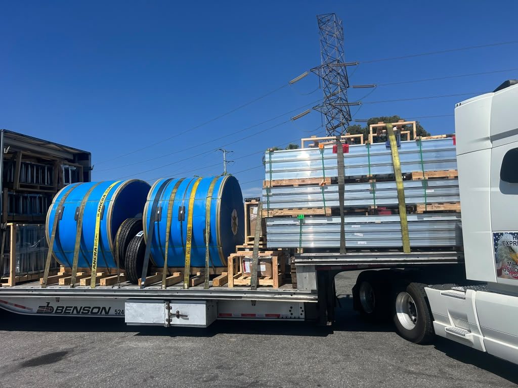 Metal and cable reels on flatbed